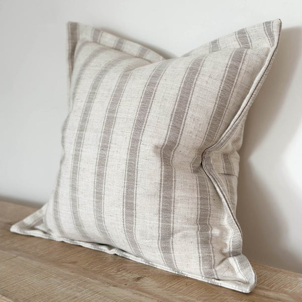 cream cushion with flanged edges a chunky diagonal  stripe 