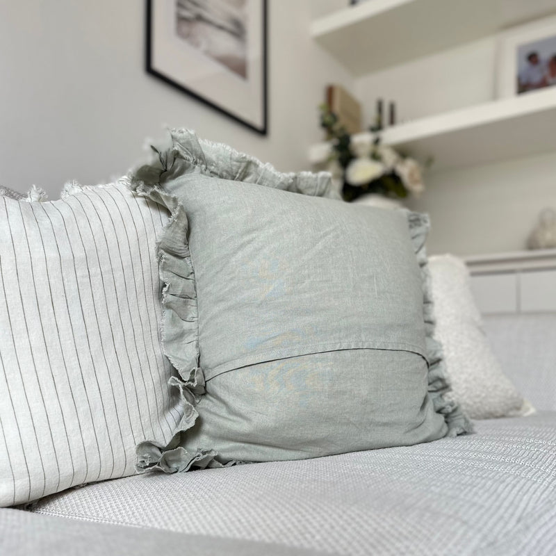 back of Ruffled edge sage green linen square cushion.