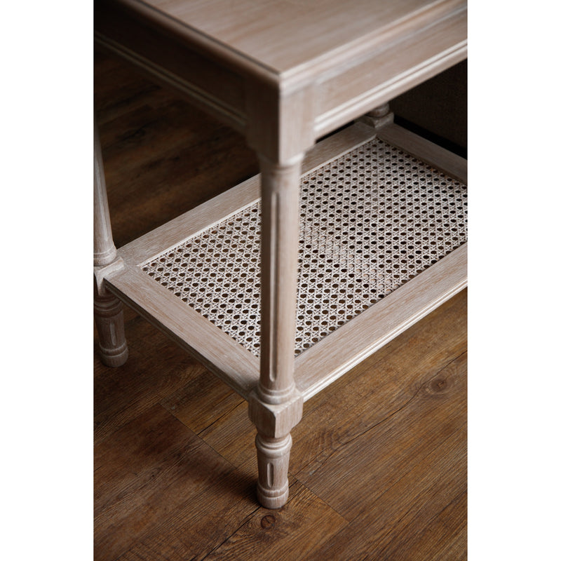 Close up of Wooden whitewash Side Table with a rattan bottom shelf