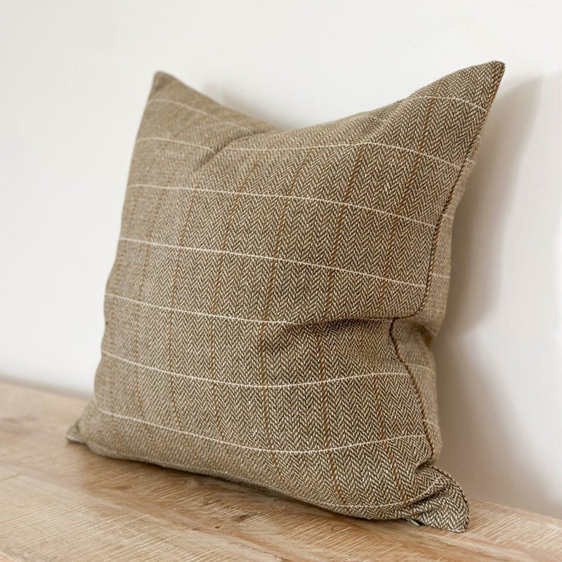 square cushion with an olive green tweed design