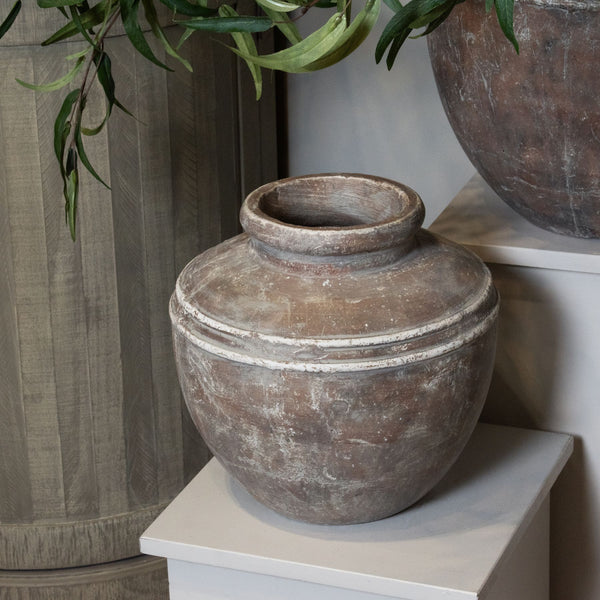 brown pot vase with a ribbed affect at the top. Round wide open neck