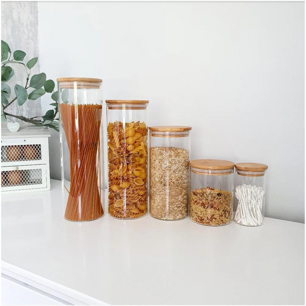 Clear Glass Jars with Bamboo Lids of varying sizes.