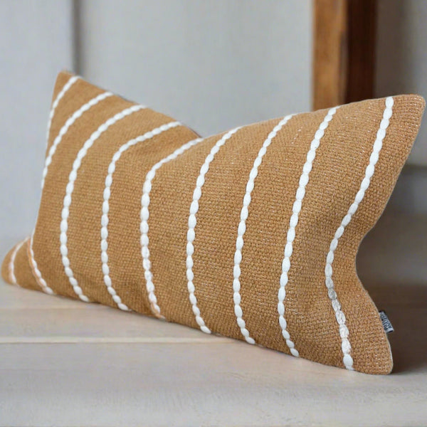 rectangle orange cushion with a white vertical repetitive stripe