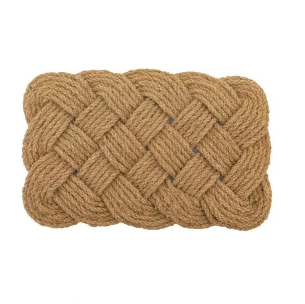 Plaited doormat on a plain white background