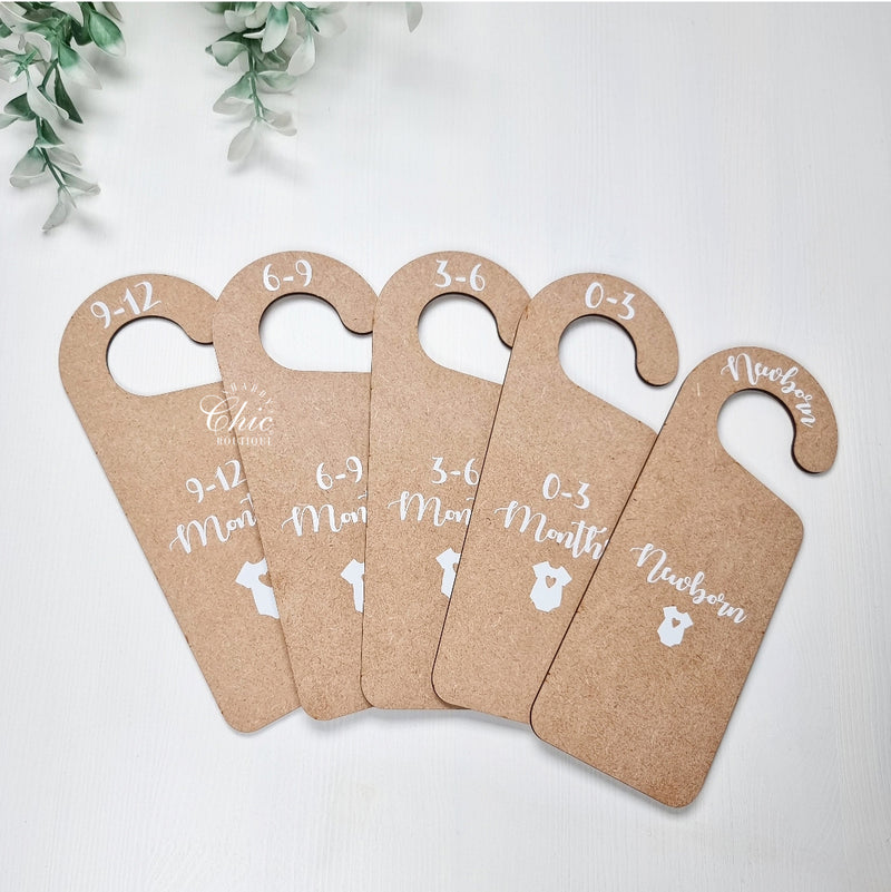 Wooden baby clothes dividers with wording for each age