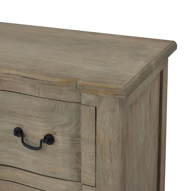 Close up of the top of the brown wooden top of the chest of drawers showing the subtle bleached wash effect