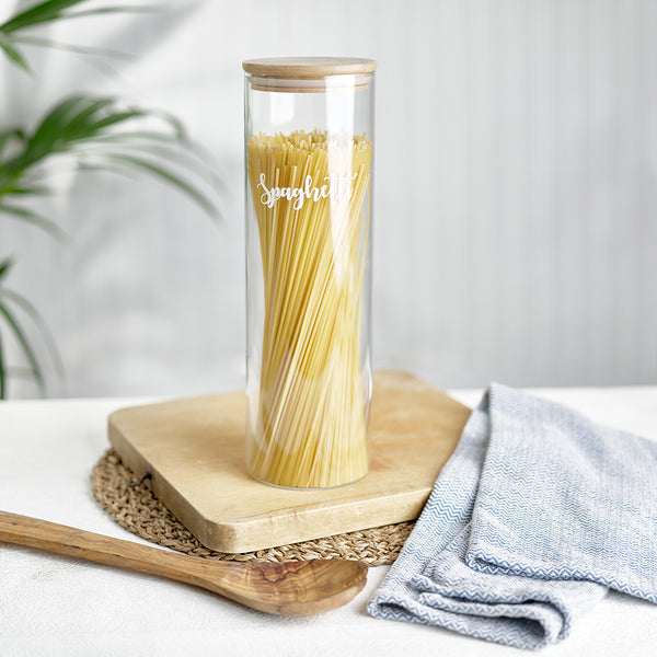  A tall, labelled glass jar with bamboo airtight lids and custom personalised wording for Spaghetti. 