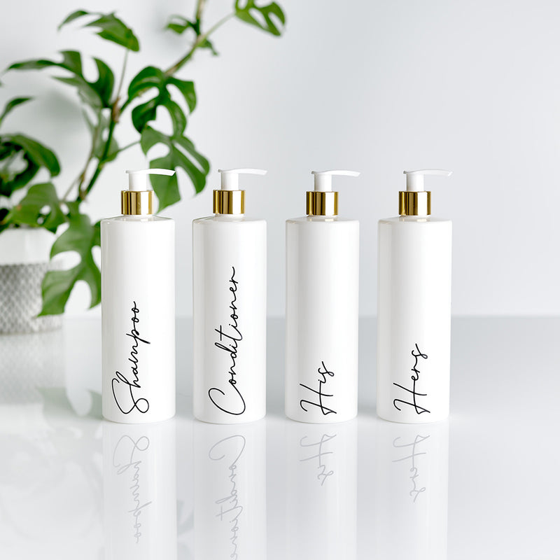 Four white and gold pump dispenser bottles with black custom personalised wording for Shampoo, Conditioner, His and Hers